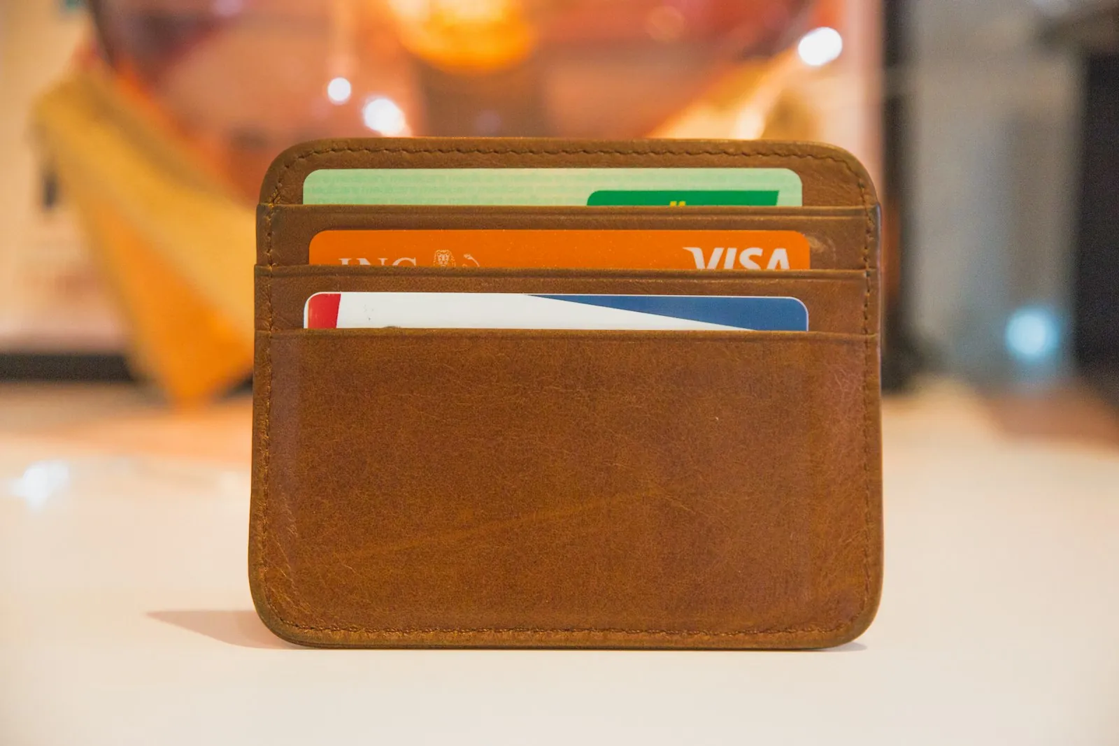 A card held in a wallet, illustrating keeping the written implant record safe.