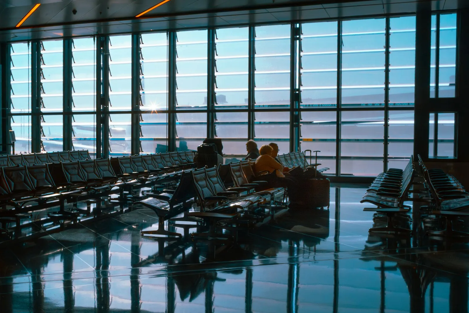 An empty departure gate, illustrating the connecting flight on the journey home.