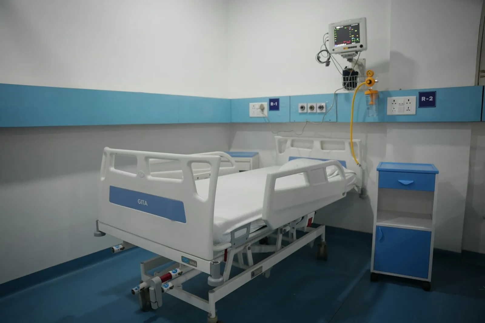 A hospital bedside in morning light, illustrating the overnight stay after surgery.