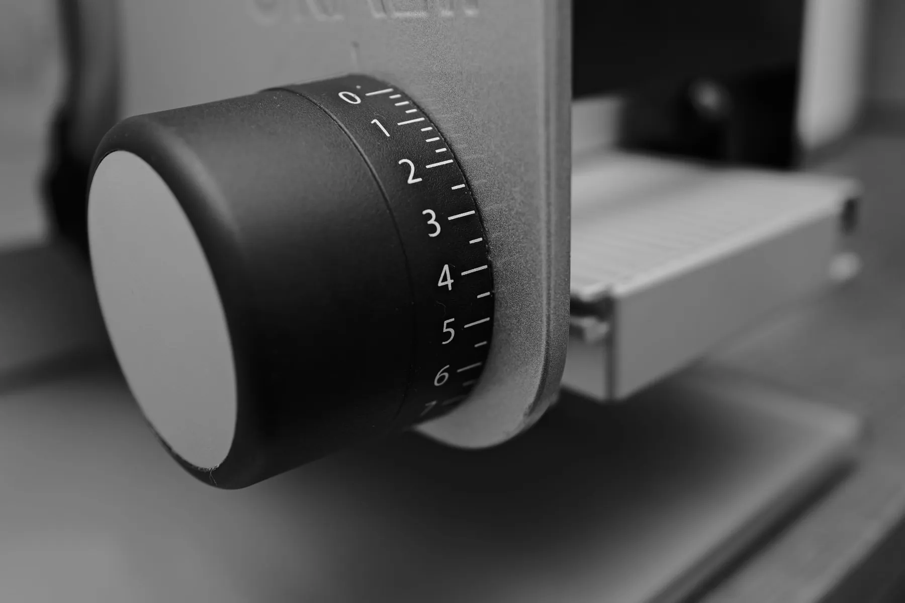 A dial being adjusted, illustrating one operation with a range of settings.