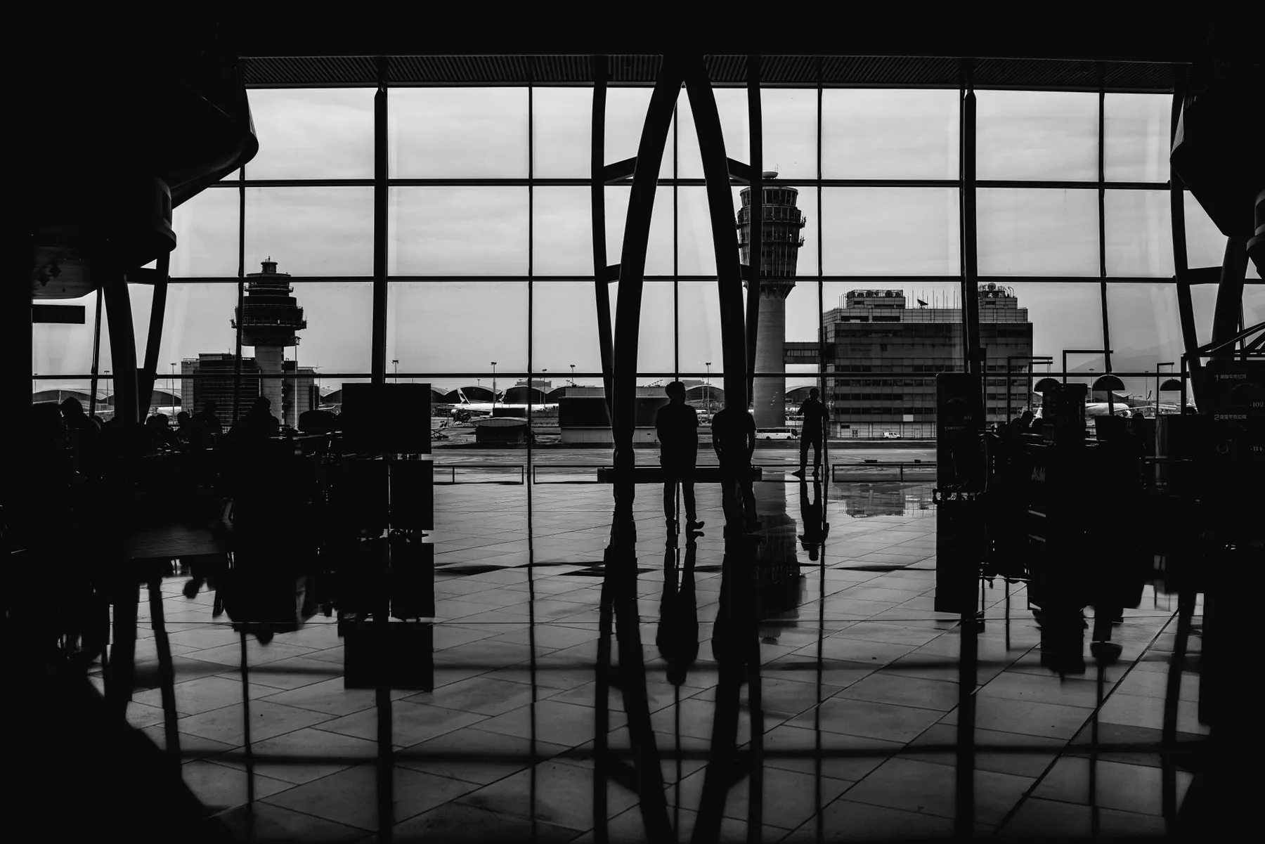 A traveller waiting alone, illustrating managing a trip without help.