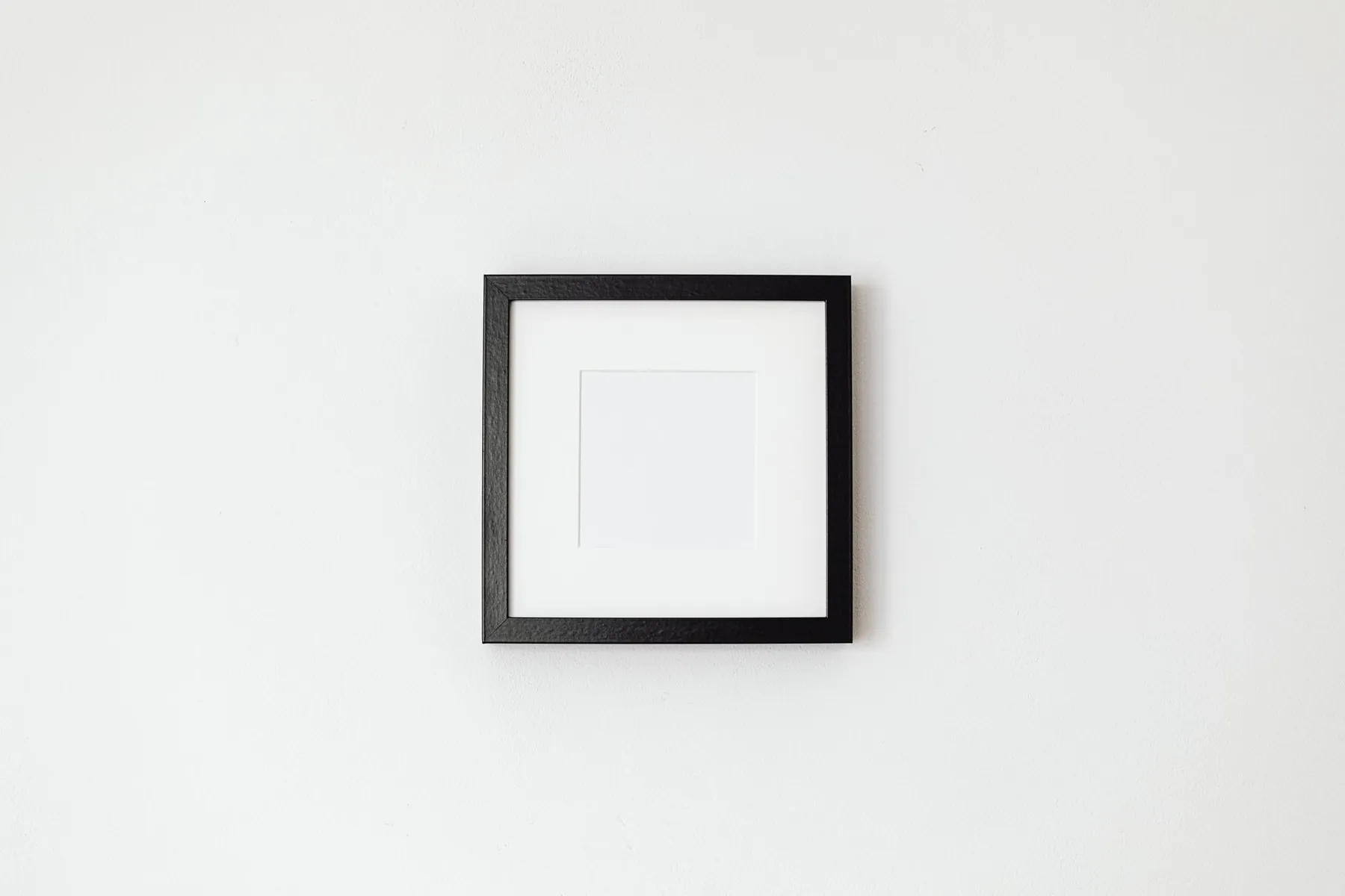 Empty frames on a wall, illustrating the absence of a results gallery.