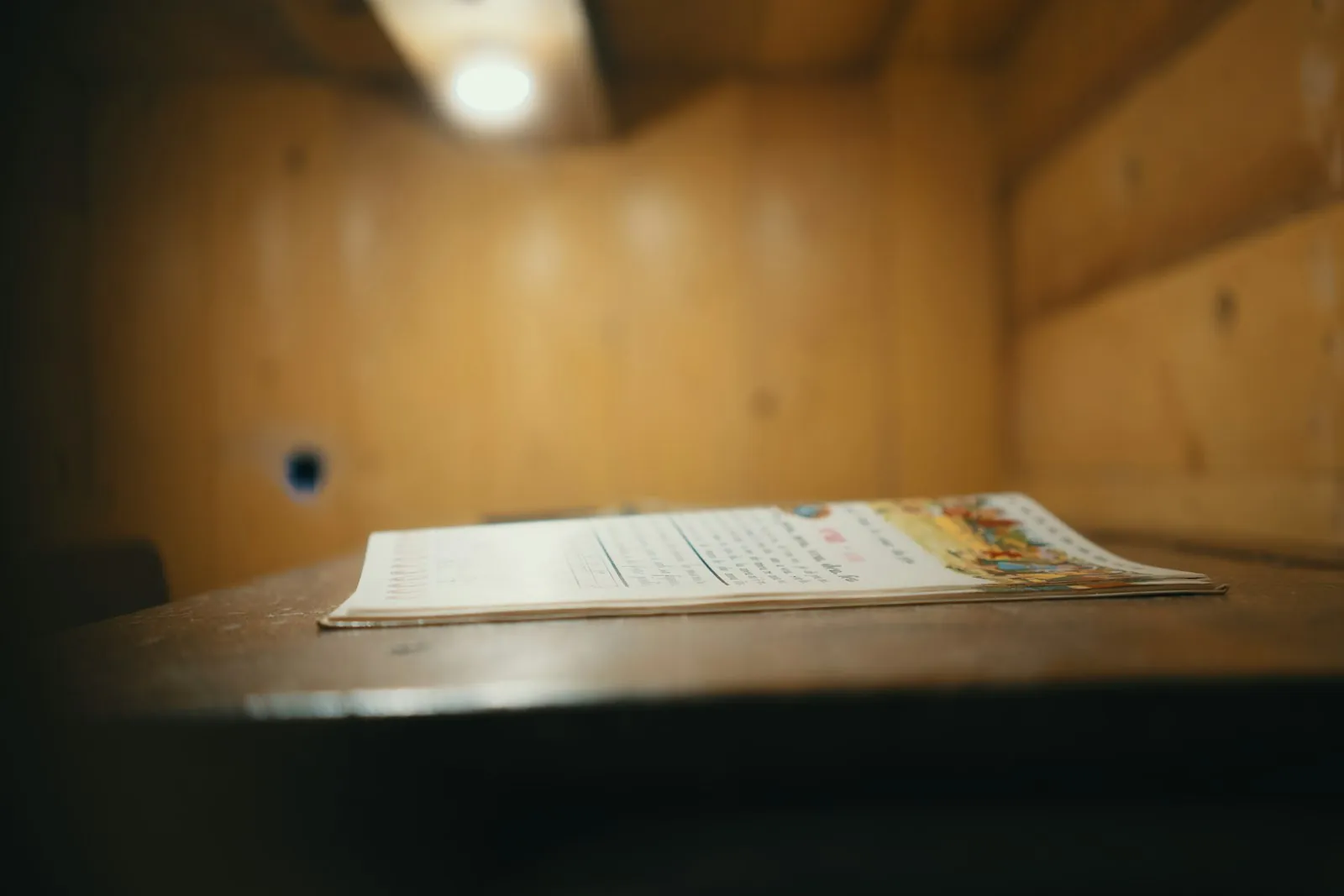 A magnifying glass over a document, illustrating verifying credentials independently.