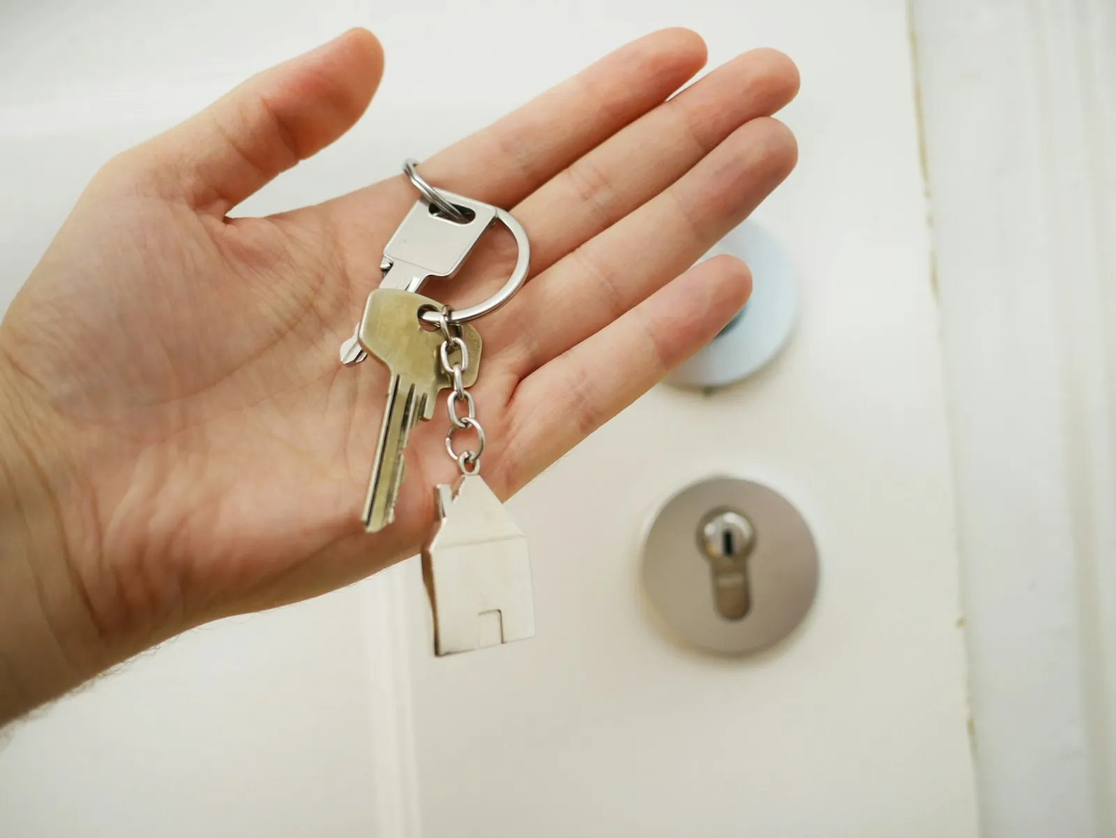 Keys at a front door, illustrating the care that continues once you are home.