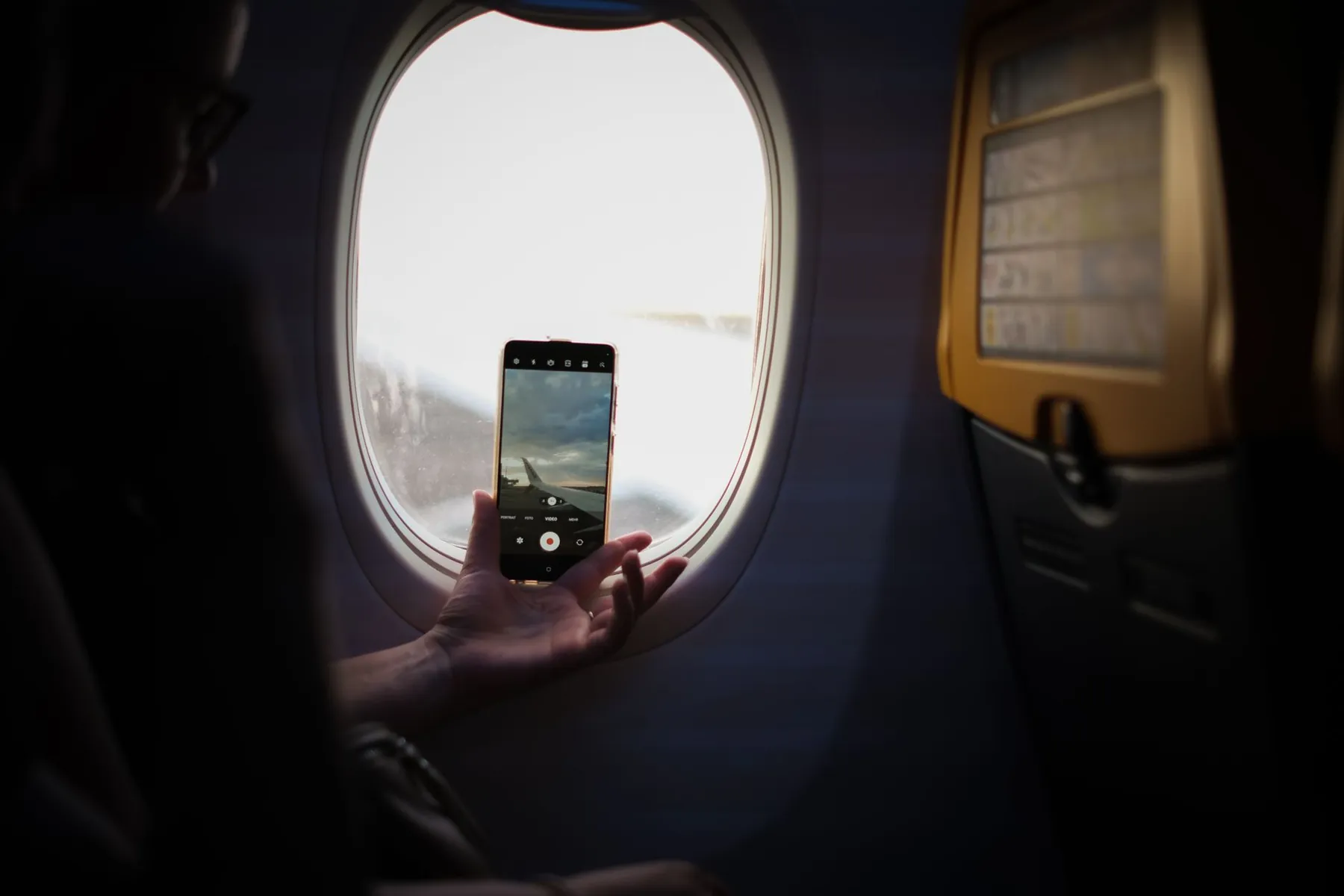 A phone camera in daylight, illustrating sending consistent progress photographs securely.