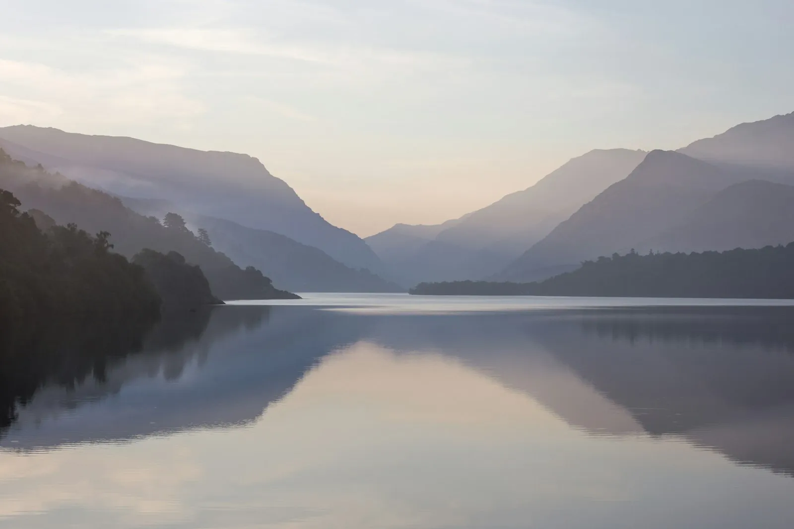 A still lake at dawn, illustrating taking time over an elective decision.