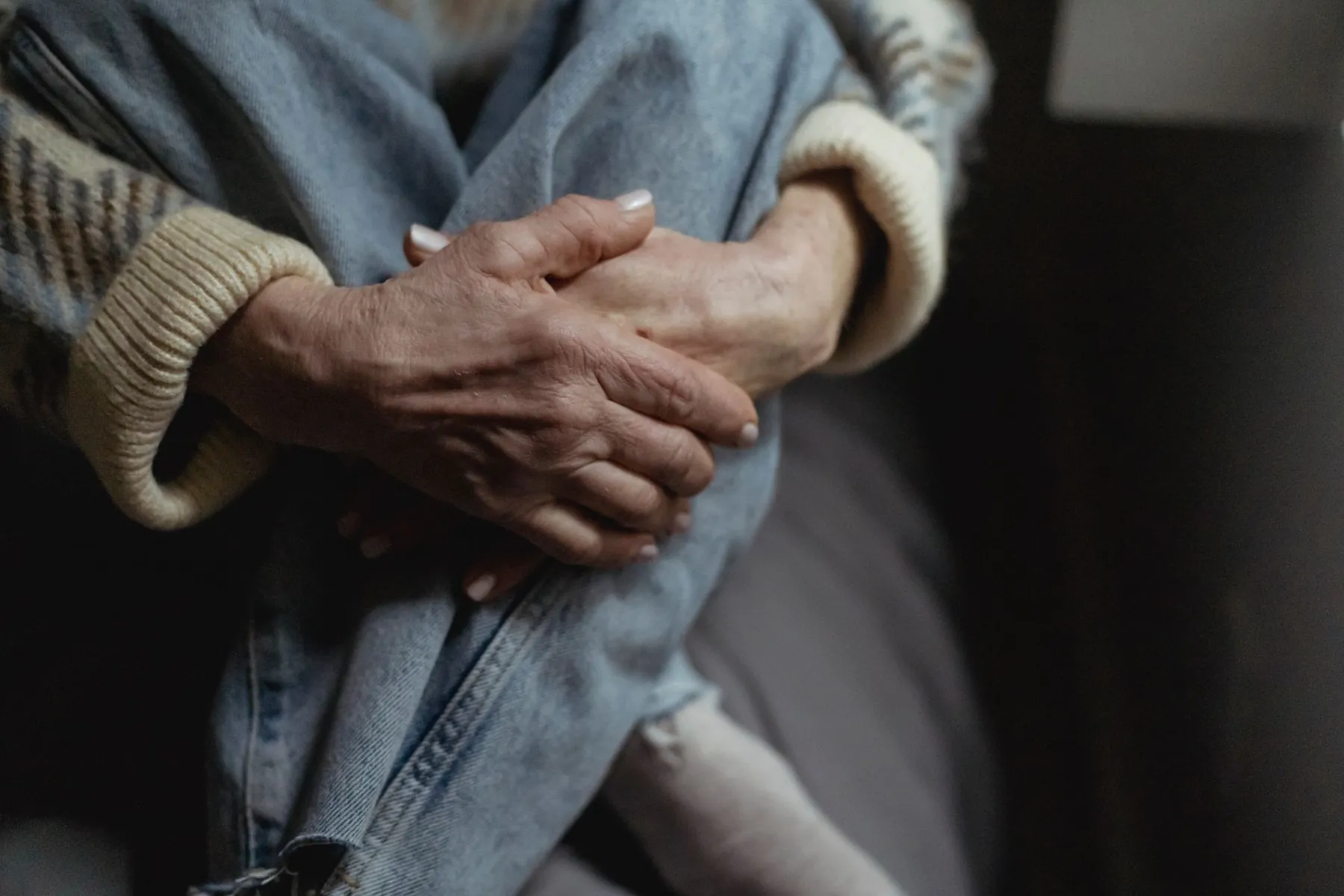 The hands of an older person resting, illustrating that health matters more than age.