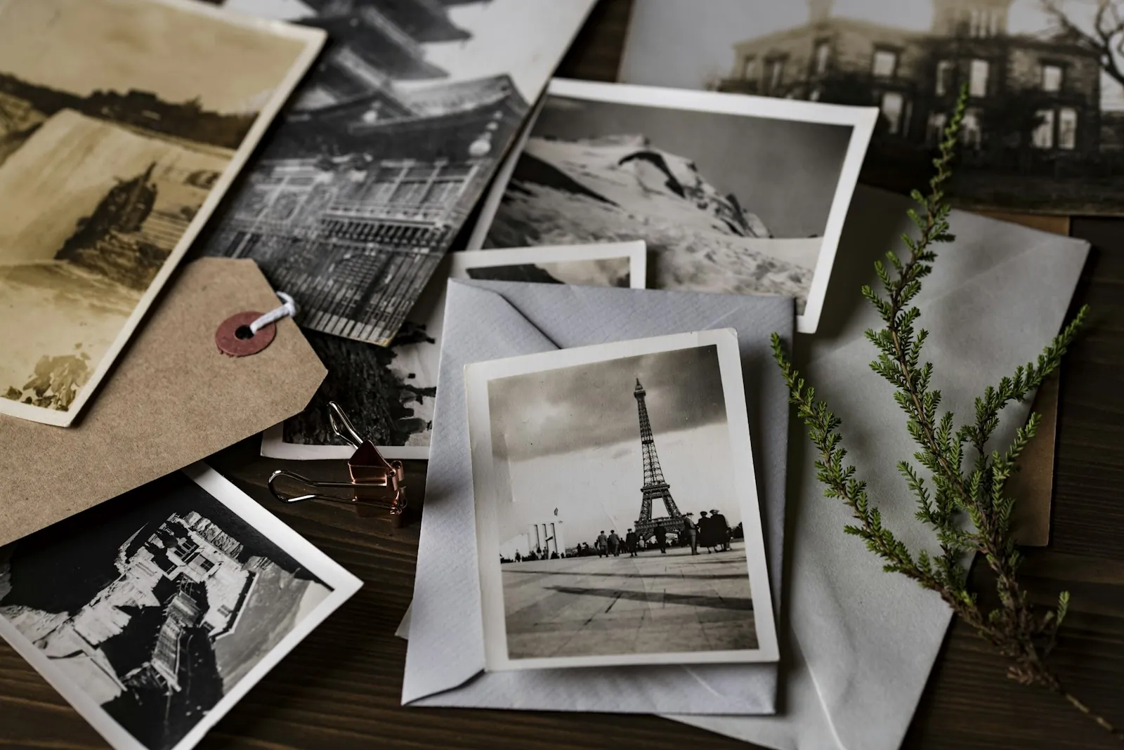Printed photographs on a table, illustrating bringing older pictures of yourself to a consultation.