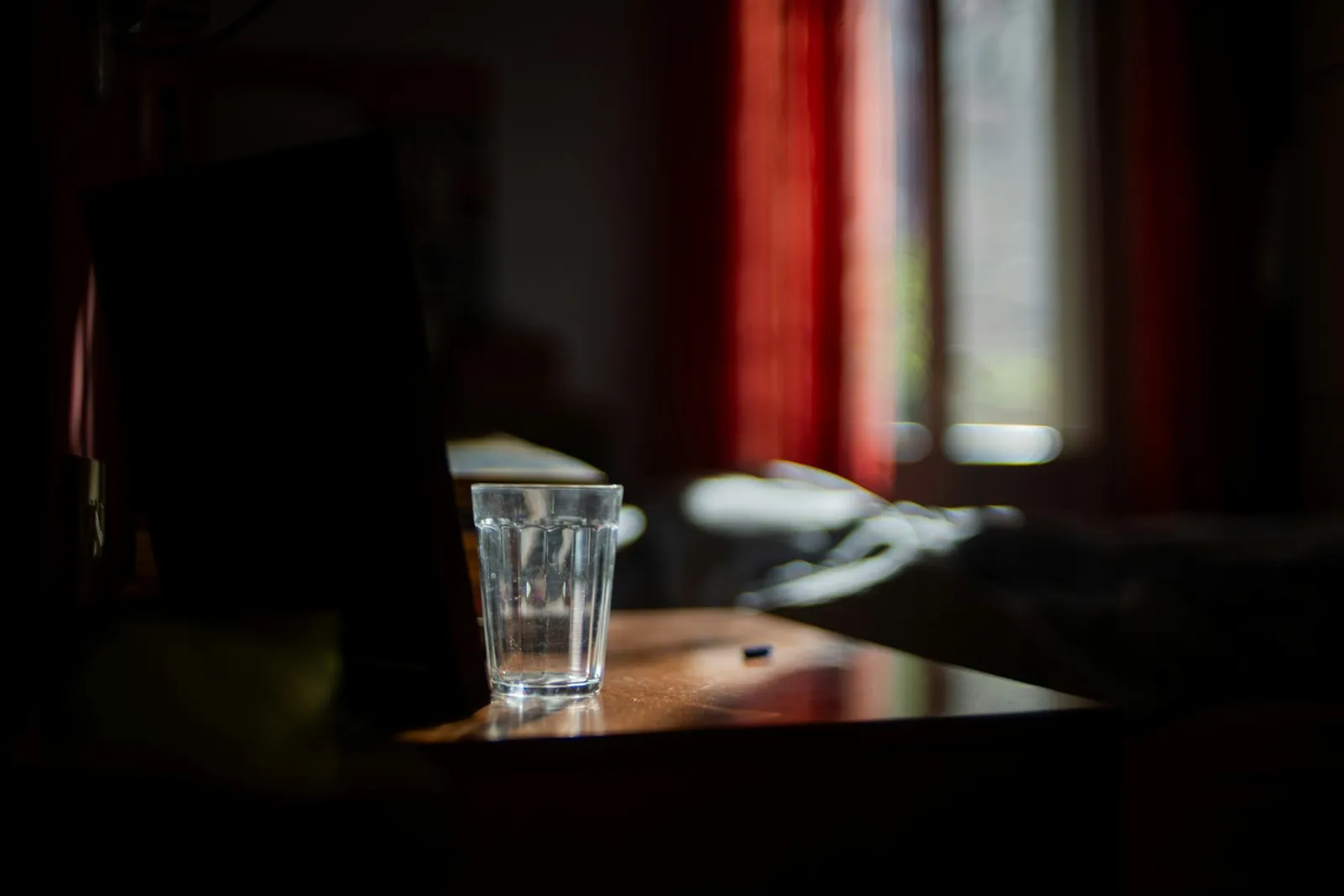 A bedside table in a quiet room, illustrating the rest that recovery requires.