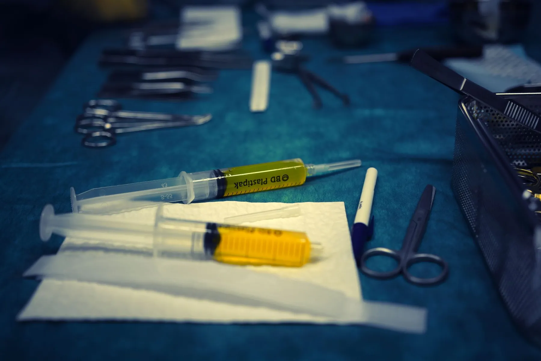 A surgical marker on a sterile drape, illustrating planning incisions before an operation.