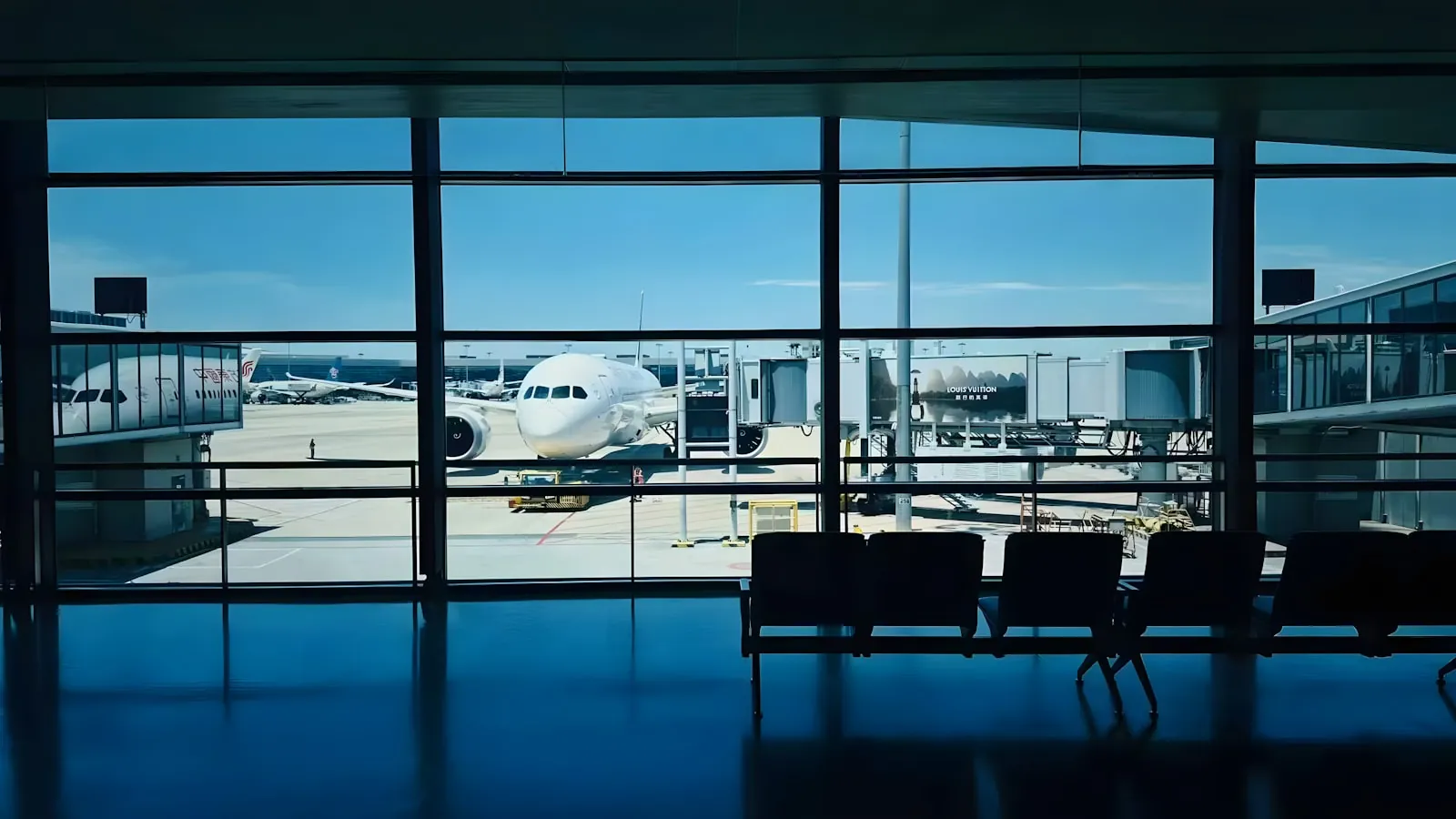 An airport terminal in daylight, illustrating planning the journey home after surgery.