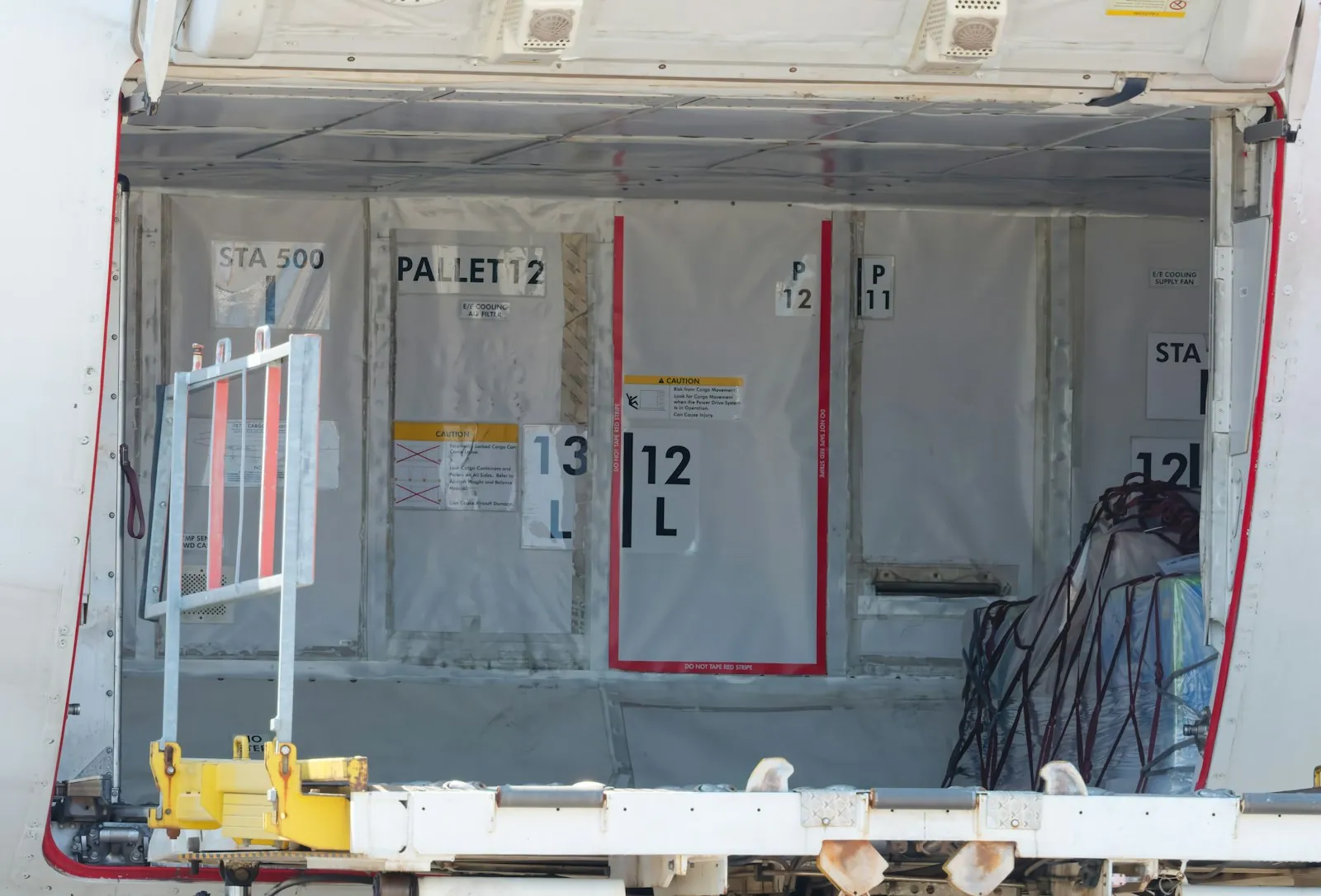 An aircraft overhead locker, illustrating the lifting to avoid after surgery.