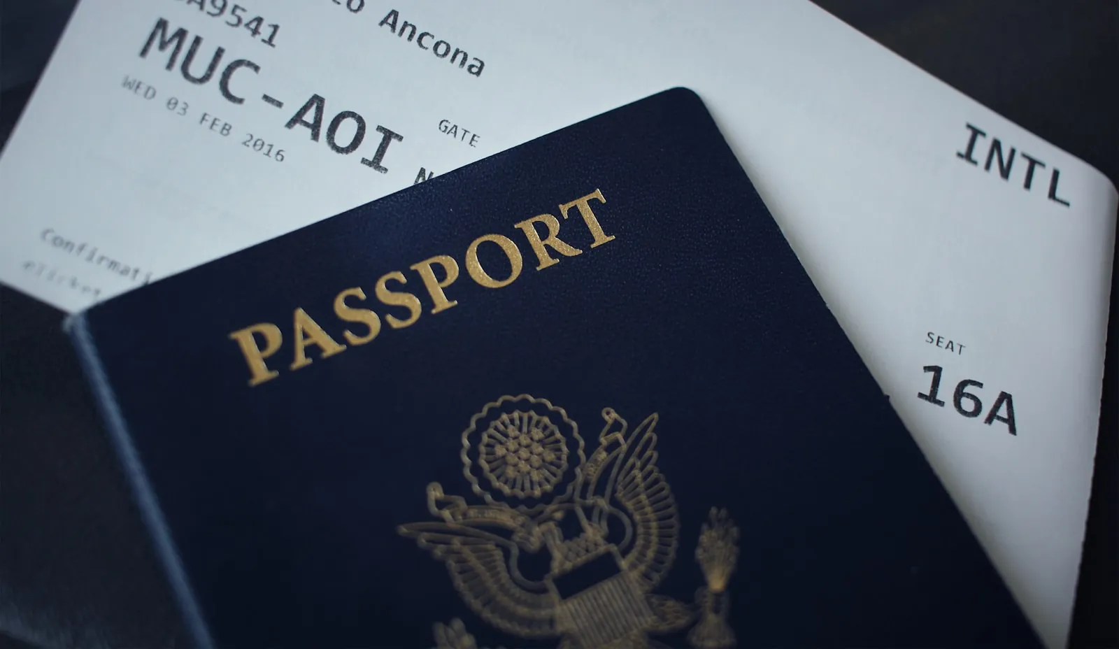 Travel documents on a table, illustrating booking a changeable return ticket.
