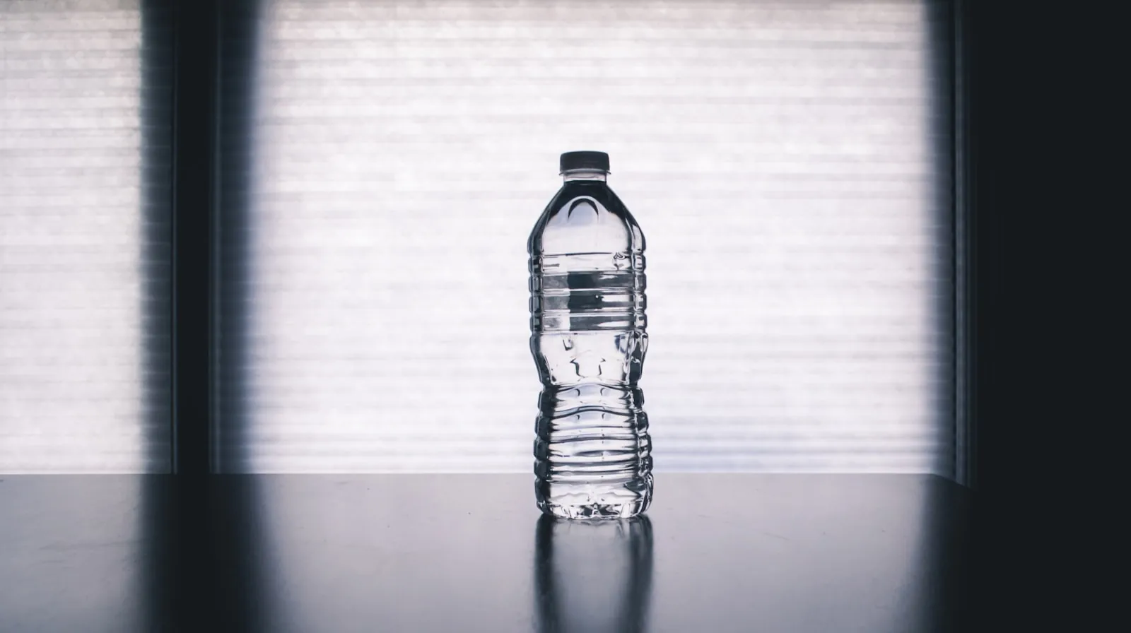 Water on a plain surface, illustrating staying hydrated on a long flight.
