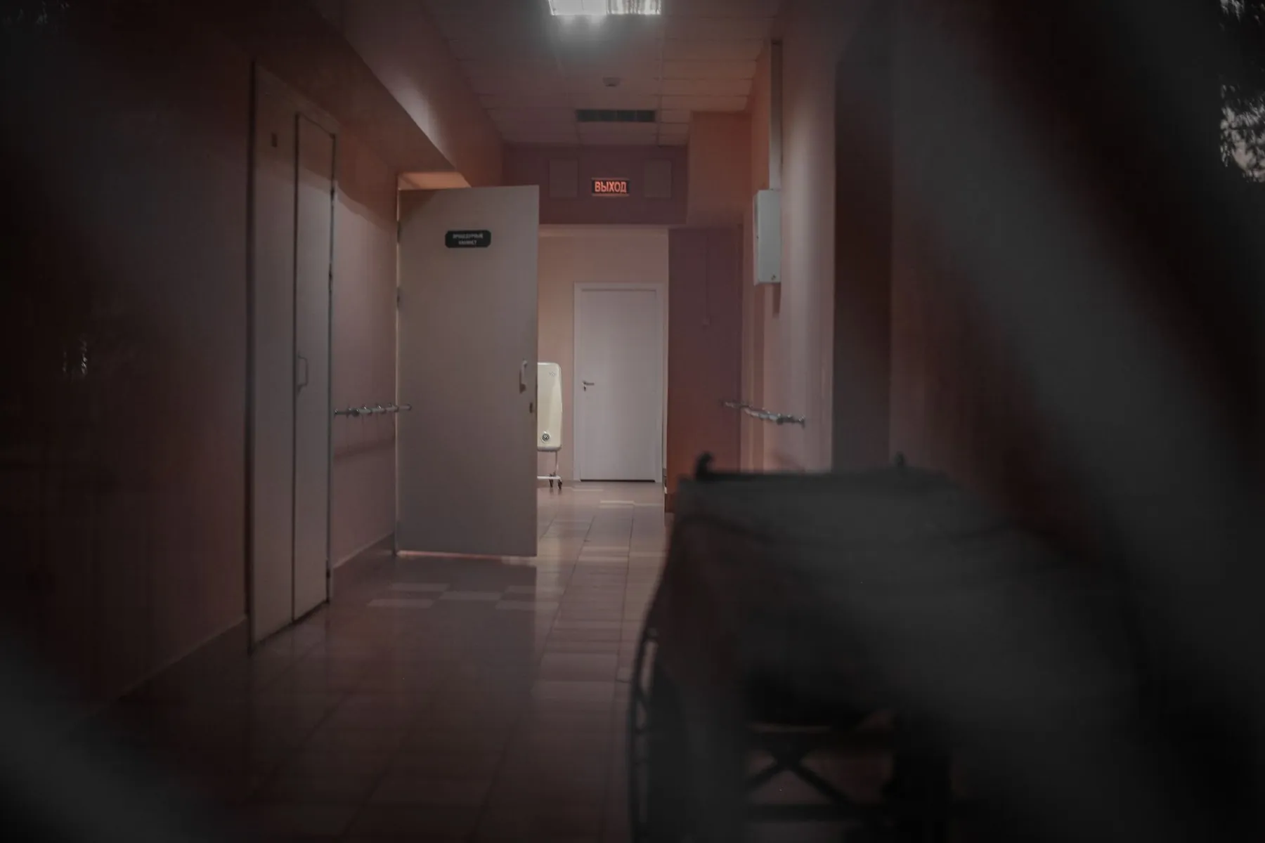 A hospital corridor towards an exit, illustrating discharge as one milestone among several.
