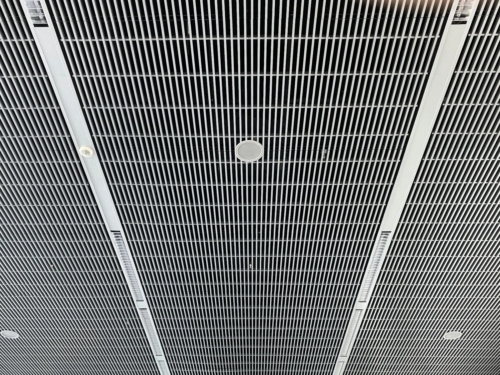 An overhead air vent above a passenger seat, illustrating airflow onto the face.