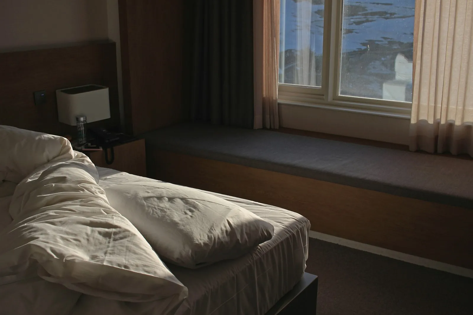 A quiet room in morning light, illustrating the rest the first days require.
