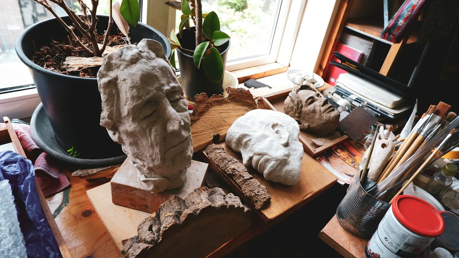 A sculptor's tools on a bench, illustrating refining a shape that has already been made.