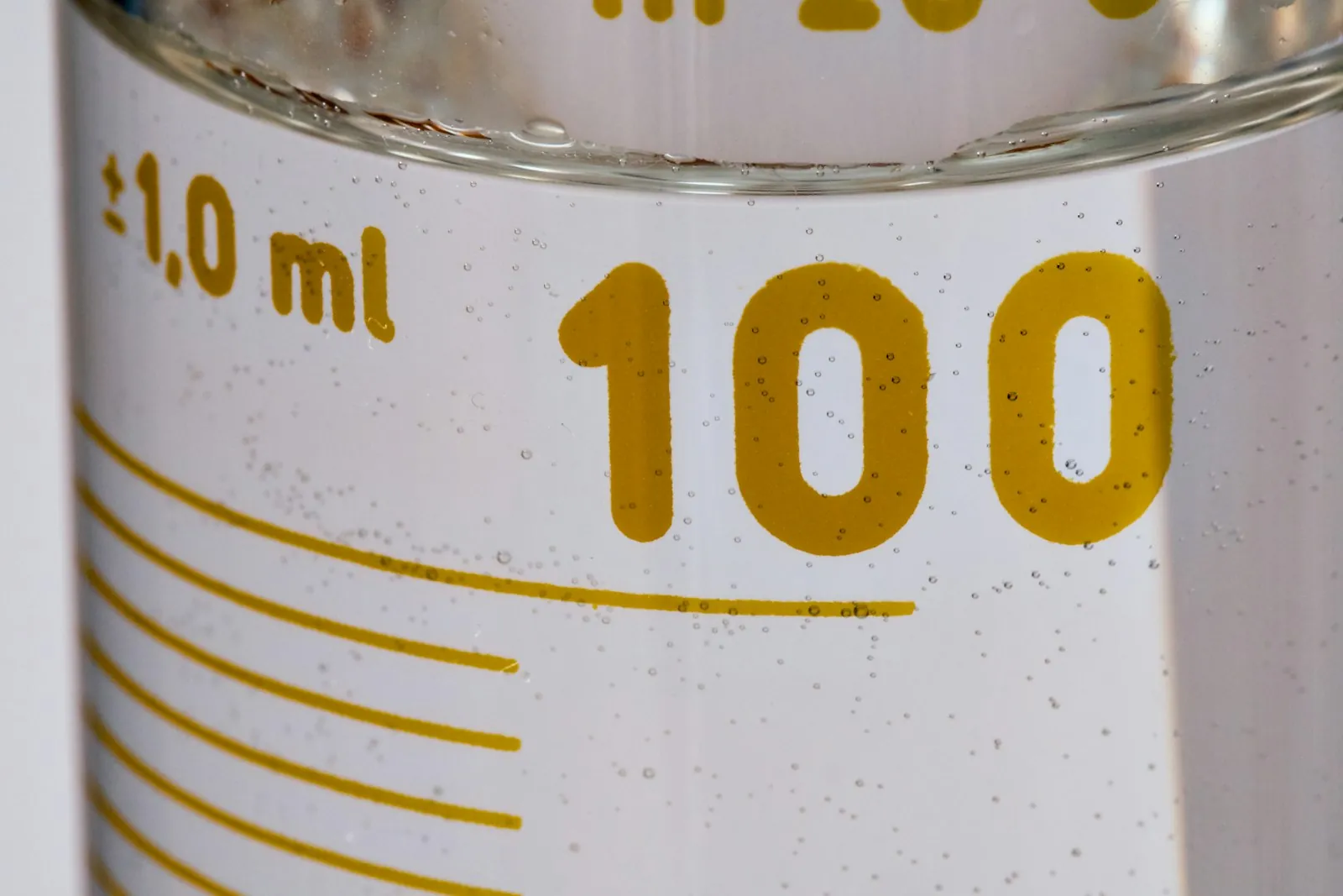 A graduated cylinder, illustrating the volume limits that make the operation safe.