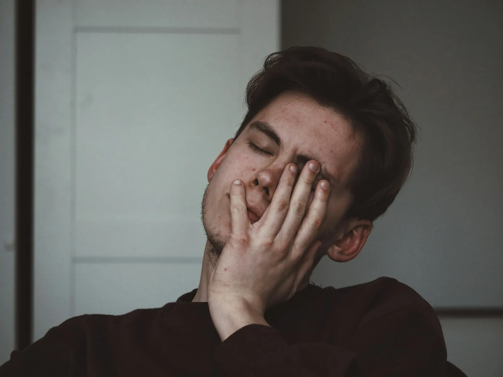 A face in window light, illustrating the tired appearance people describe.