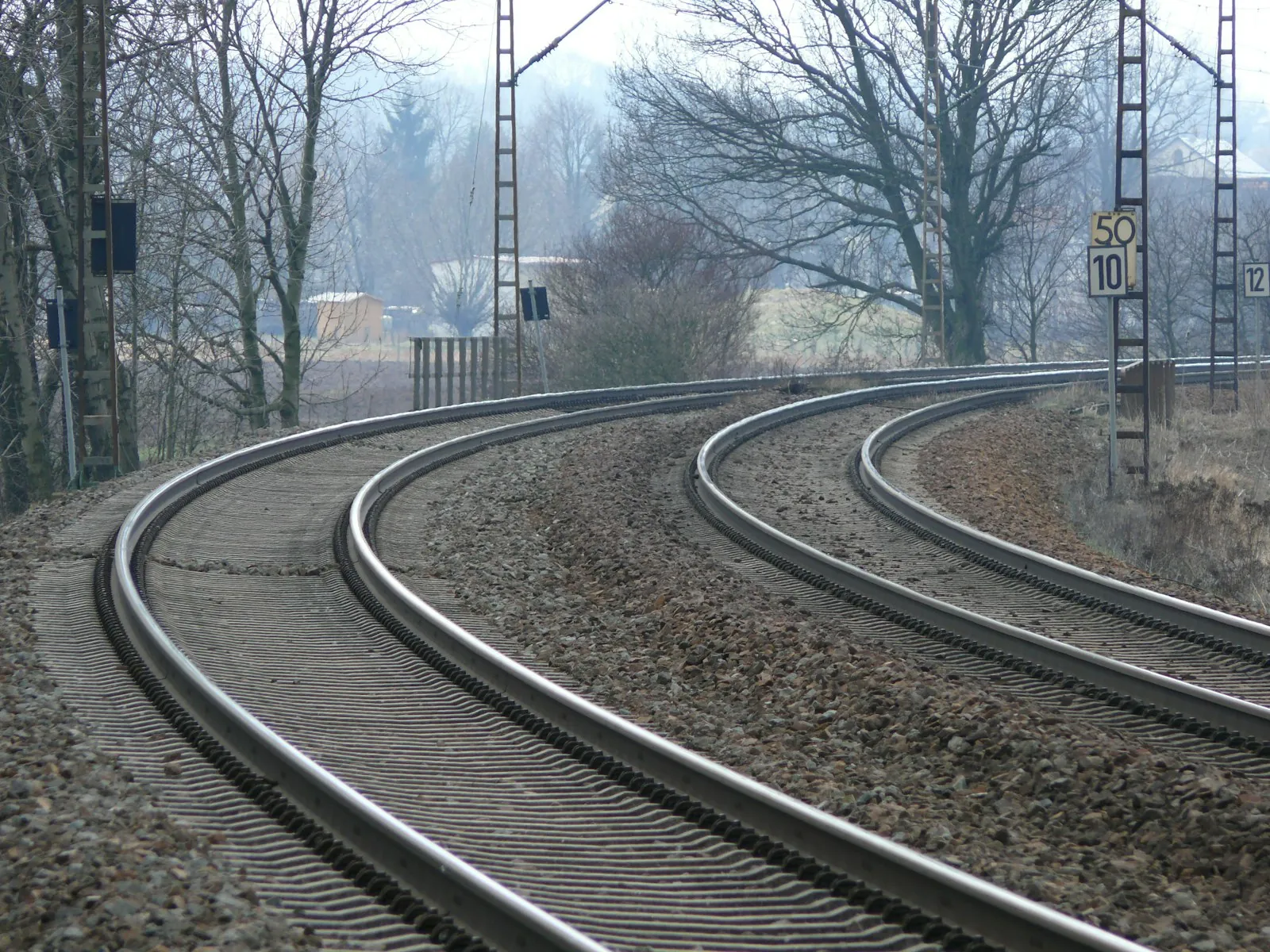 Two tracks diverging, illustrating two kinds of problem on different timetables.