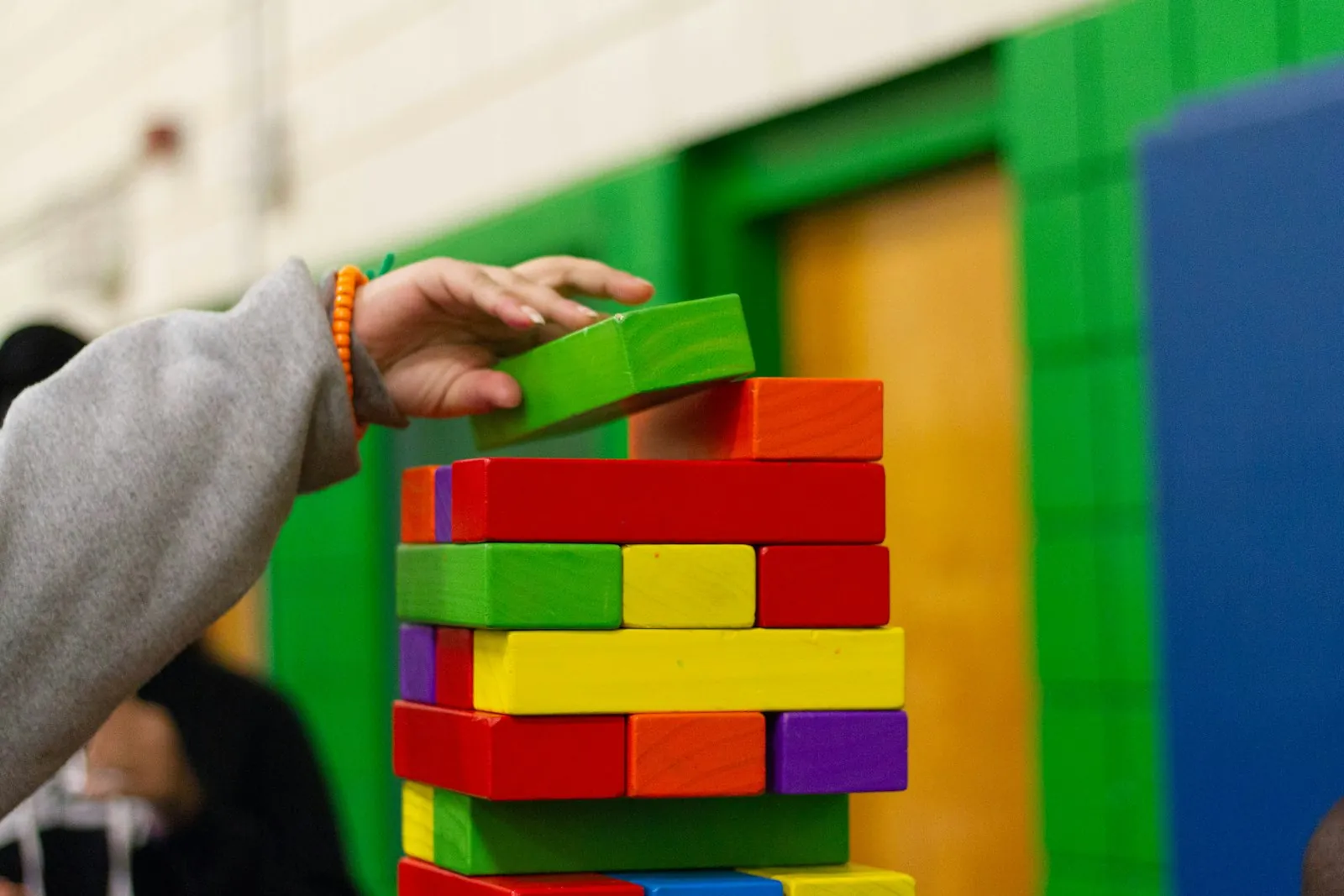 Blocks being stacked upward, illustrating building structure up.