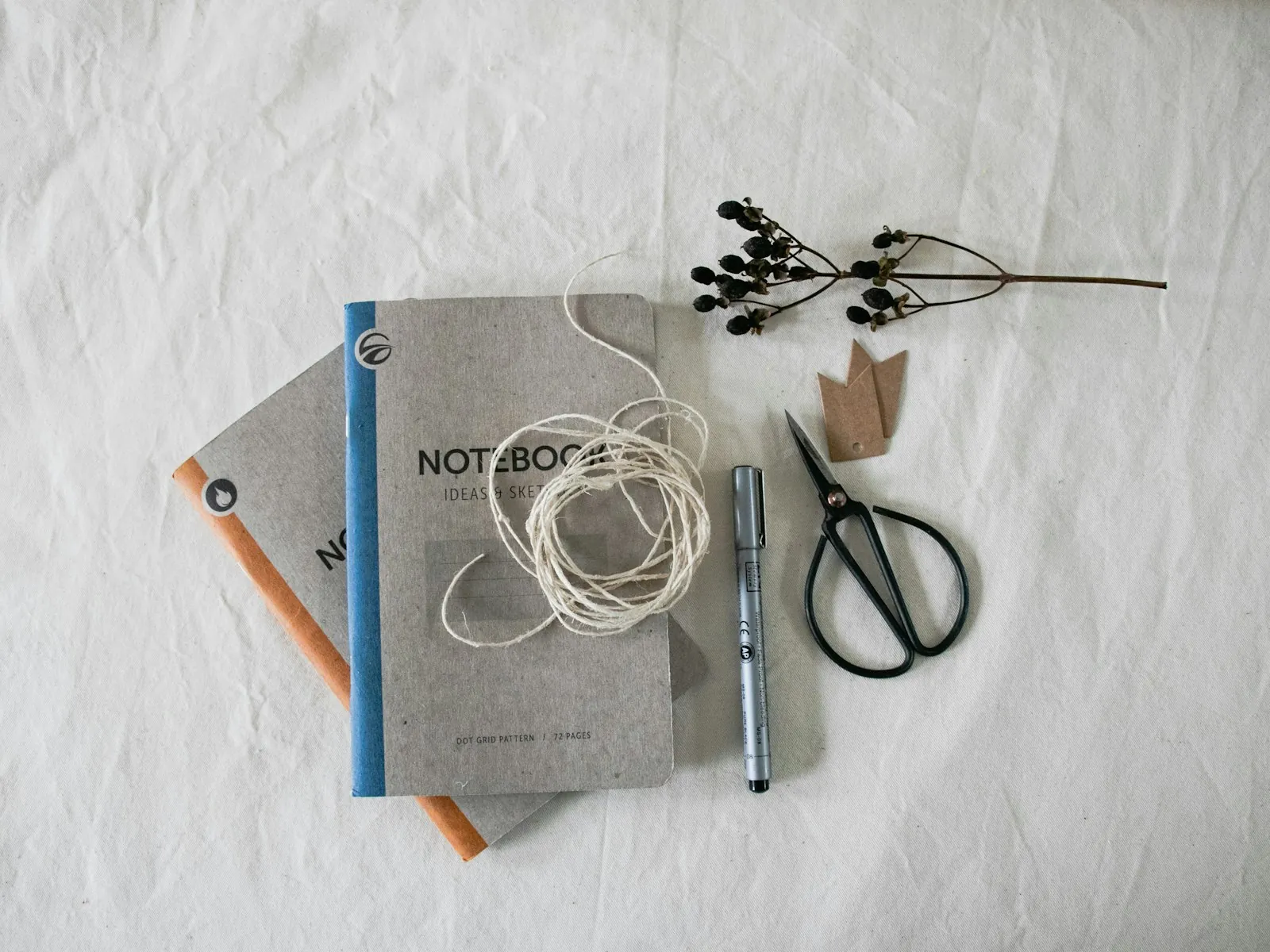 Dark loose clothing folded, illustrating what to pack for the first days.