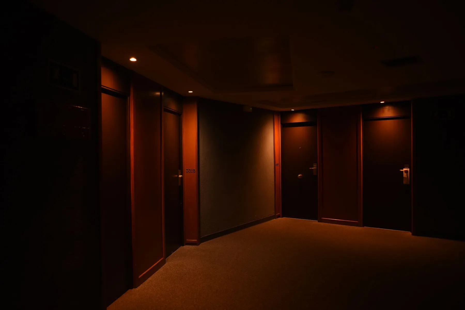 A quiet corridor and lift, illustrating choosing accommodation for the first week.