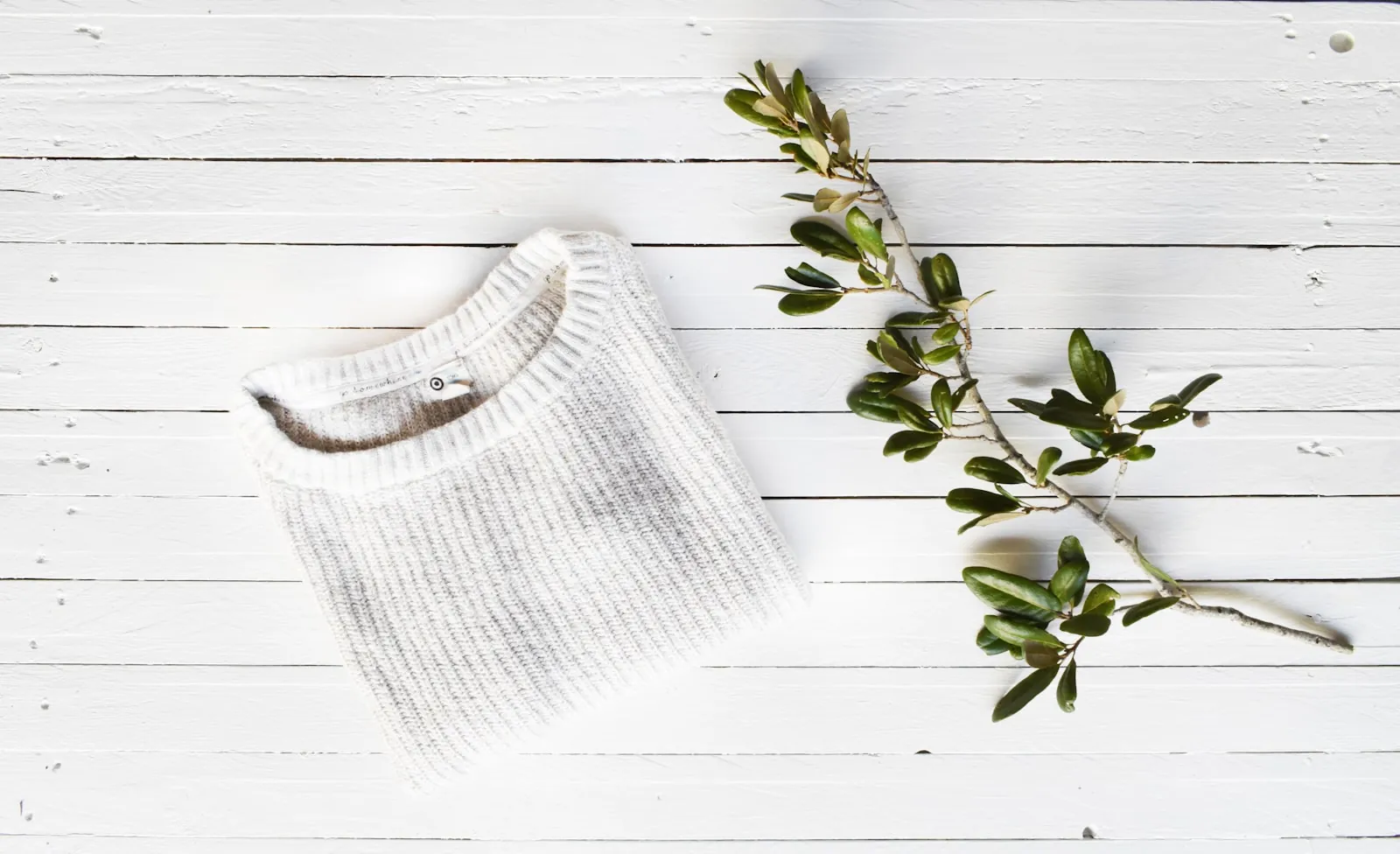 Soft folded clothing in neutral tones, illustrating loose clothing that is easy to wear after surgery.