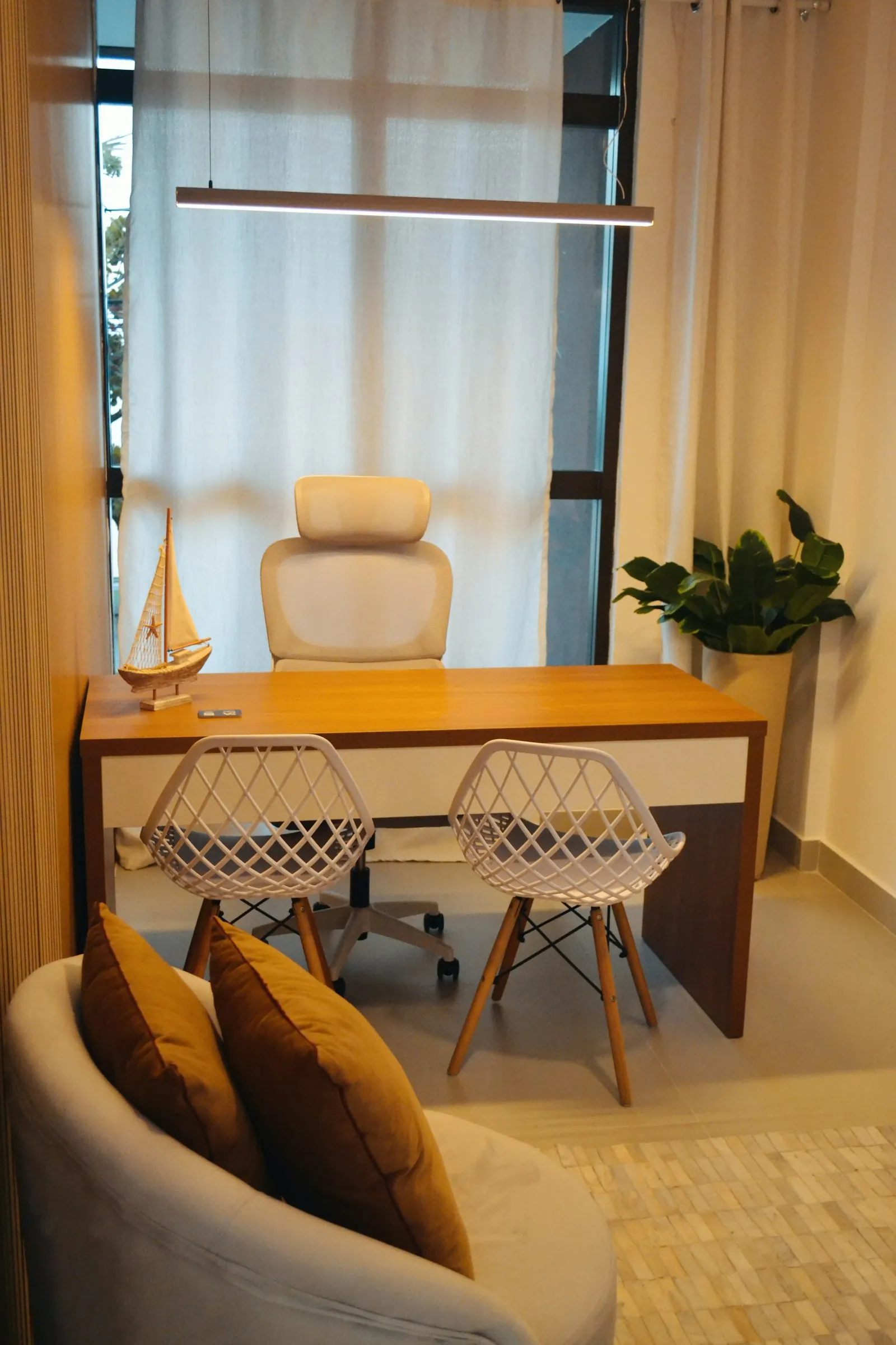 A warm, neutral consultation interior in daylight.