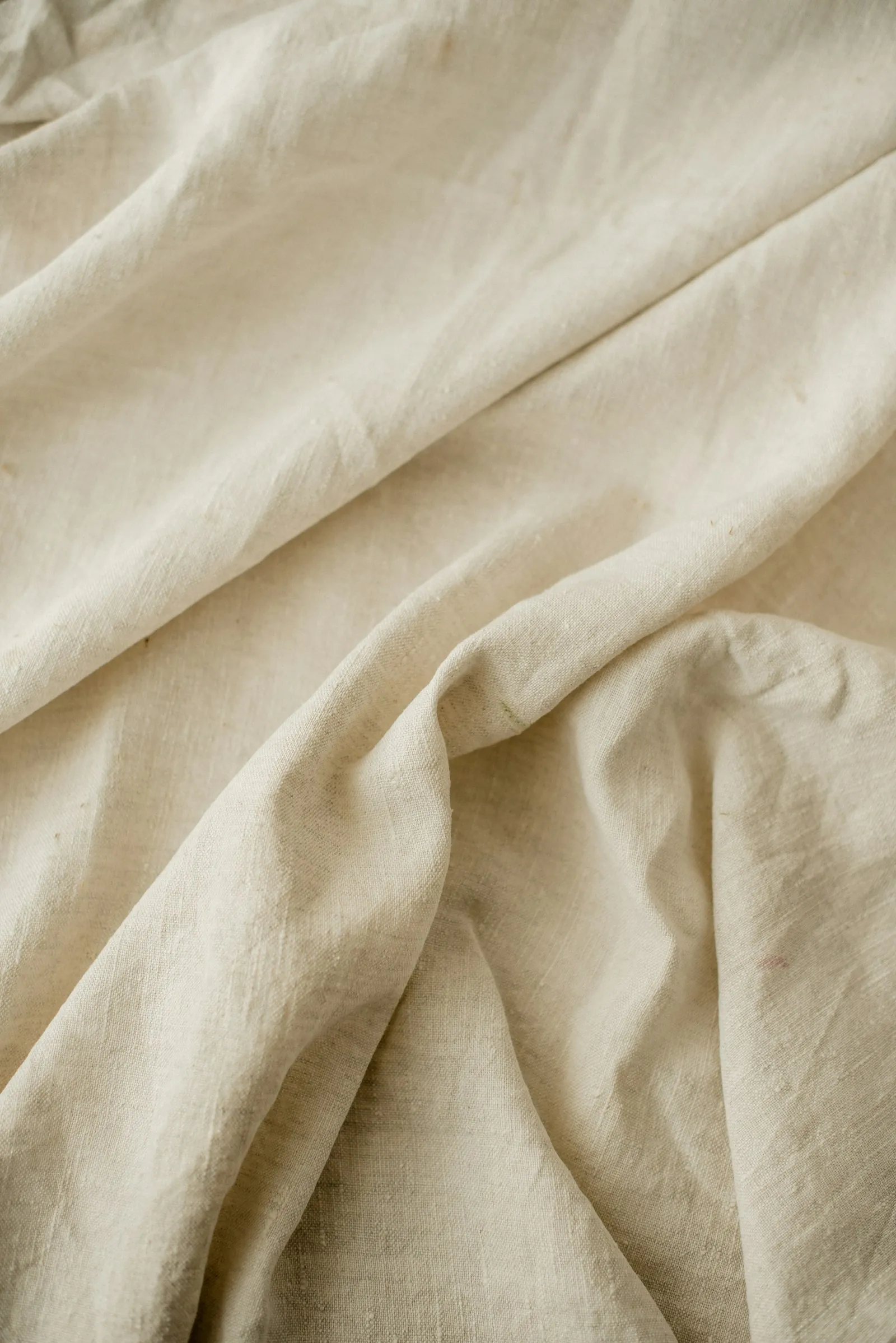 Soft linen folds in neutral daylight.