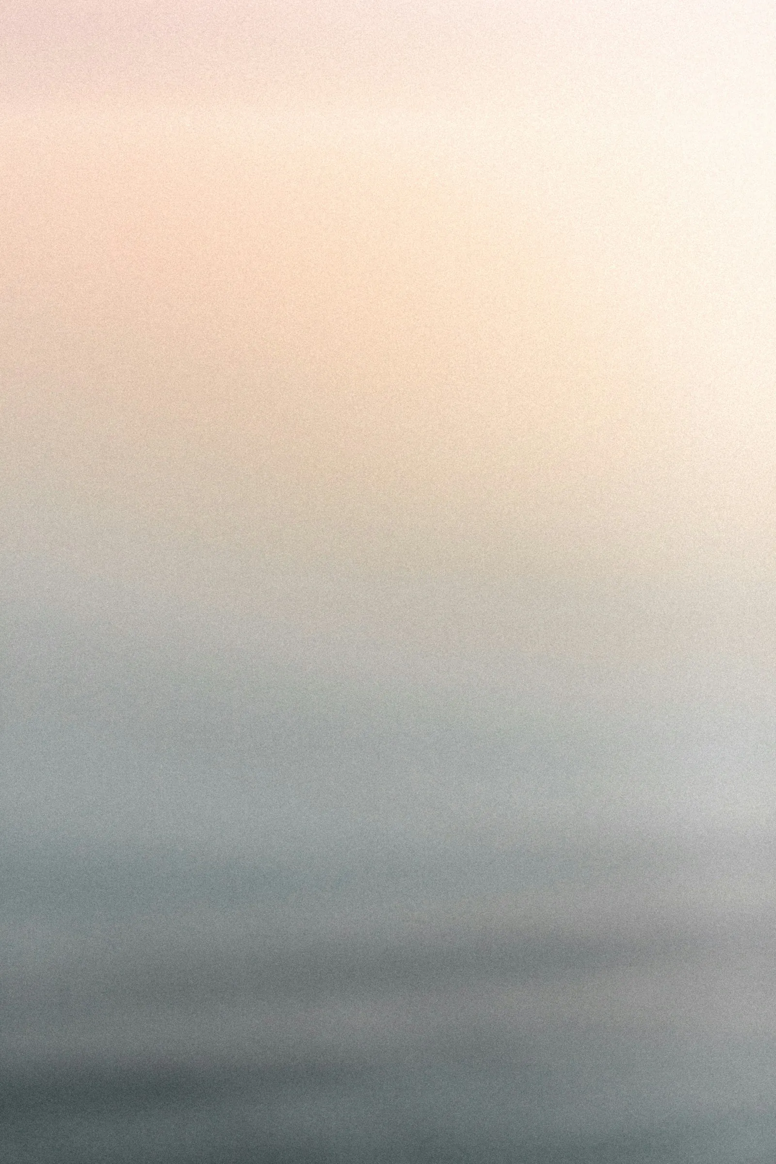 A still water surface with a soft reflection.