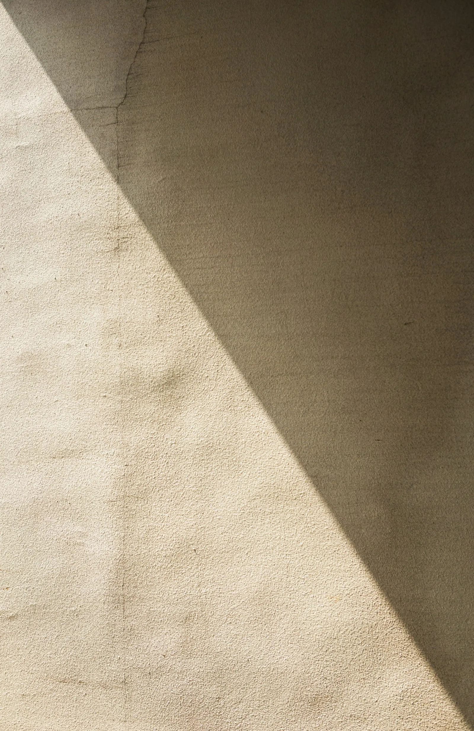A sculptural stone form in soft shadow.