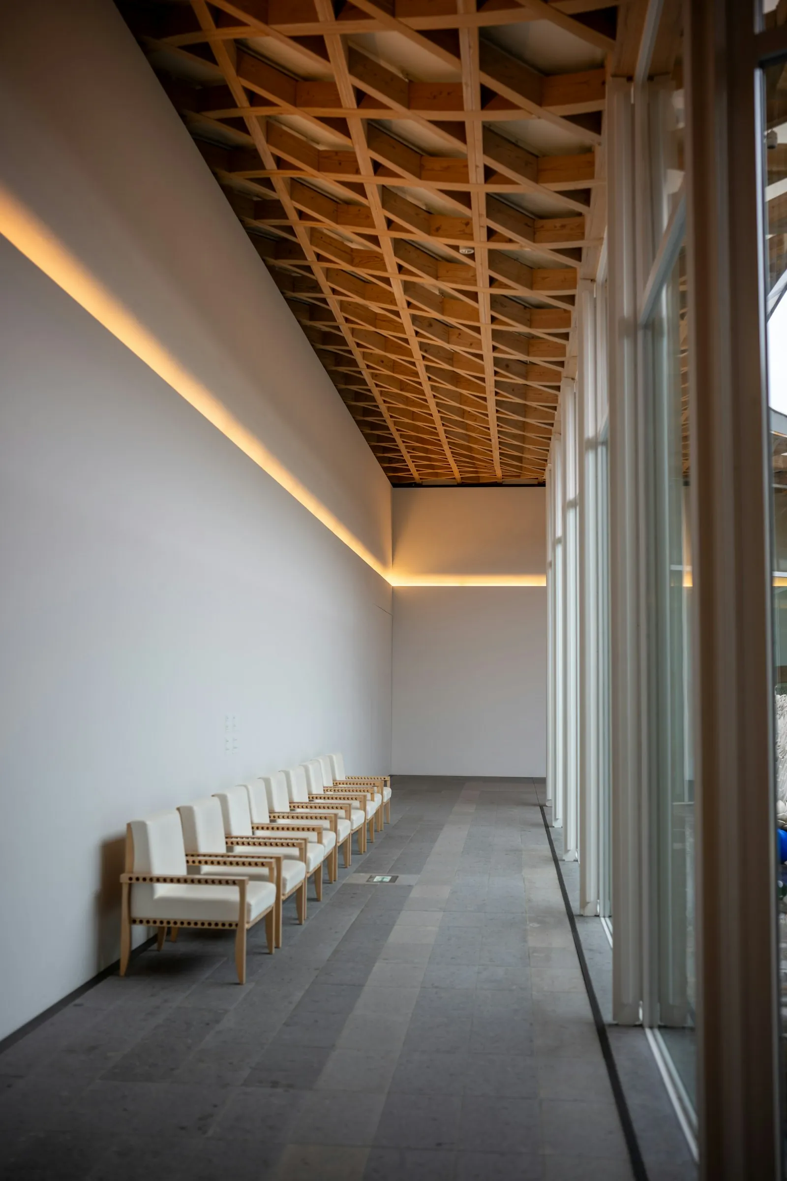An empty chair in a calm waiting area.