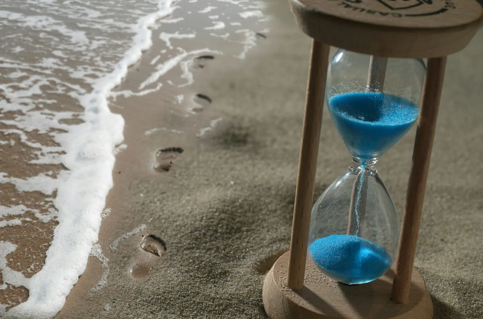 Sand passing slowly through a timer, illustrating a result measured in months.