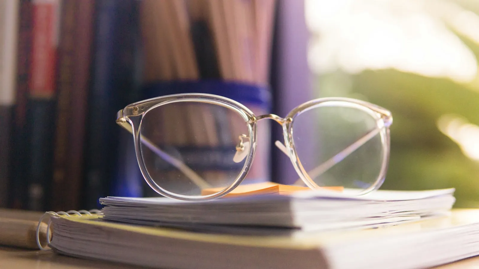 Glasses set aside on a table, illustrating keeping weight off the bridge.