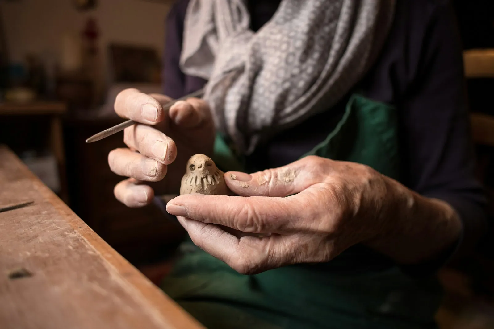 Material being carved by hand, illustrating an implant shaped for the individual.