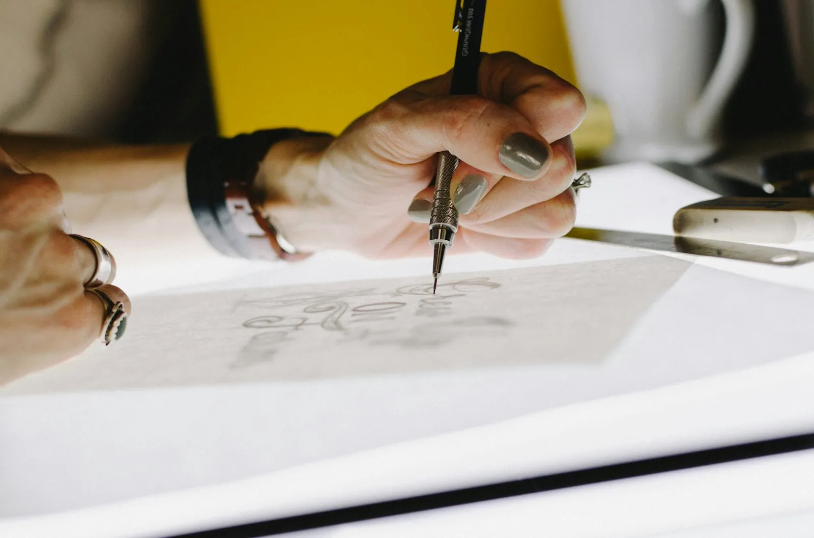 A drawing being worked out on paper, illustrating a surgical plan taking shape.