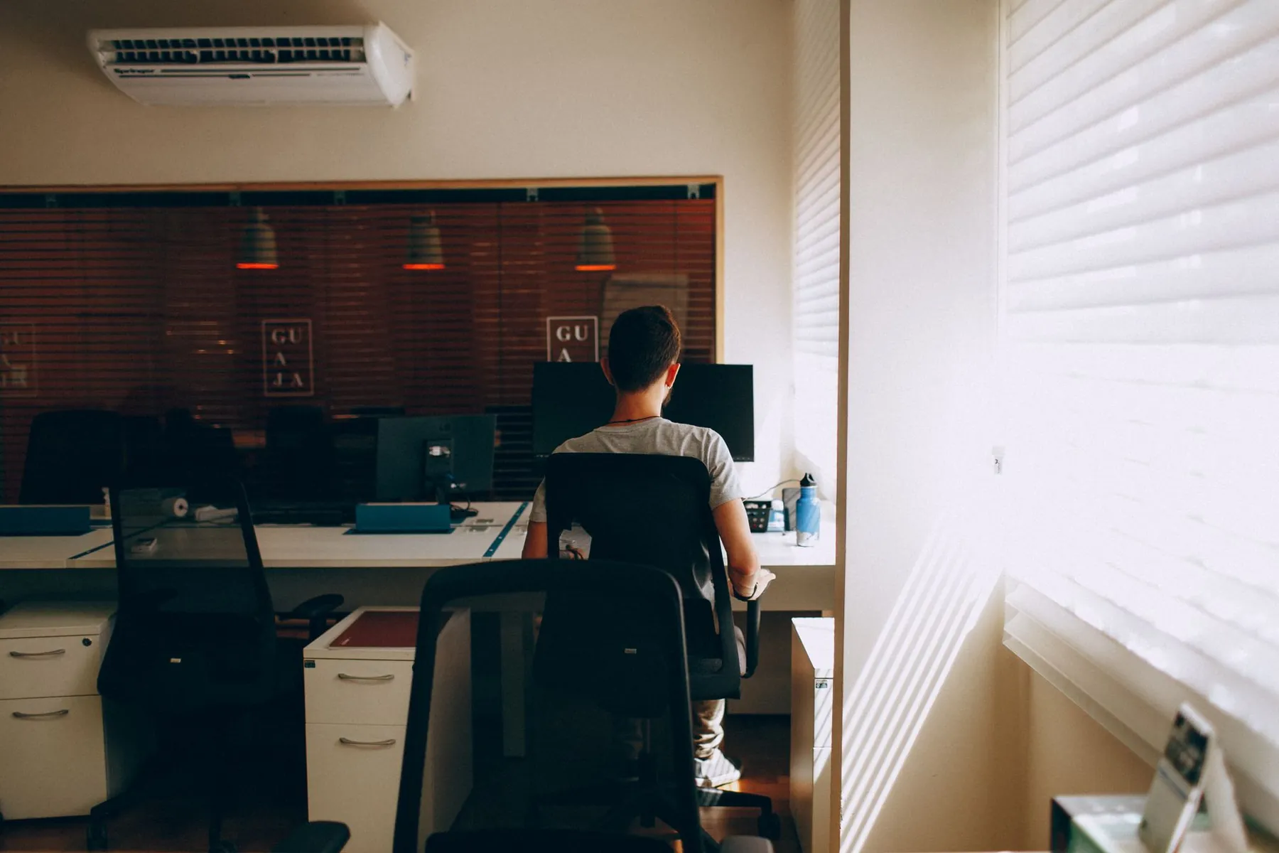 A desk beneath an air vent, illustrating what makes dry eyes worse at home.