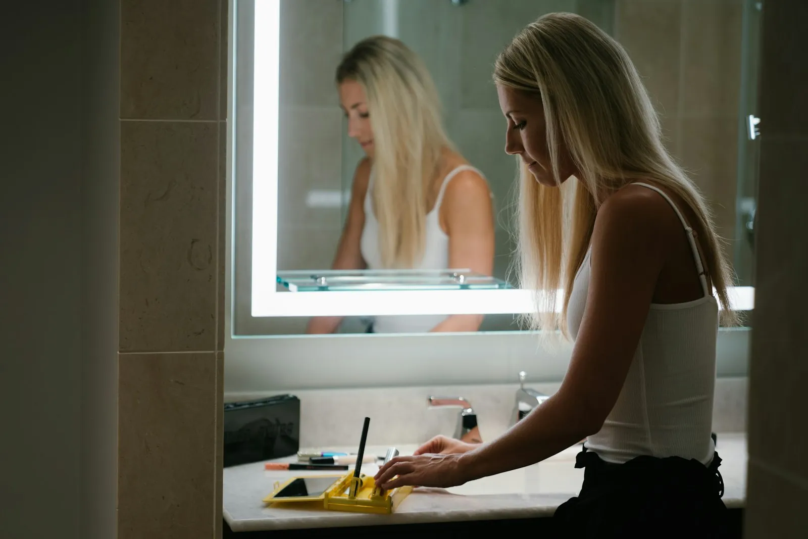 Someone looking into a mirror, illustrating being shown the marks before surgery.