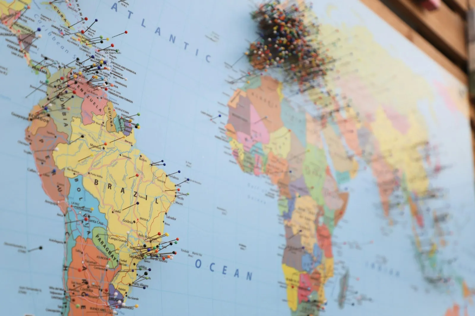 A map with pins, illustrating planning eyelid surgery from another country.