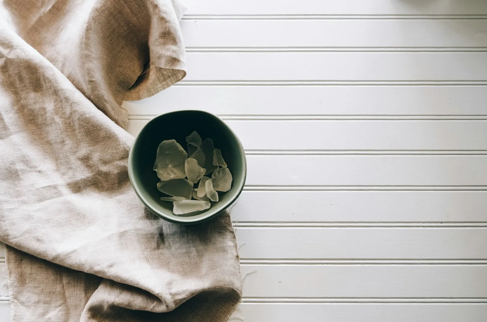 A cool compress prepared at a bedside, illustrating the first days of recovery.